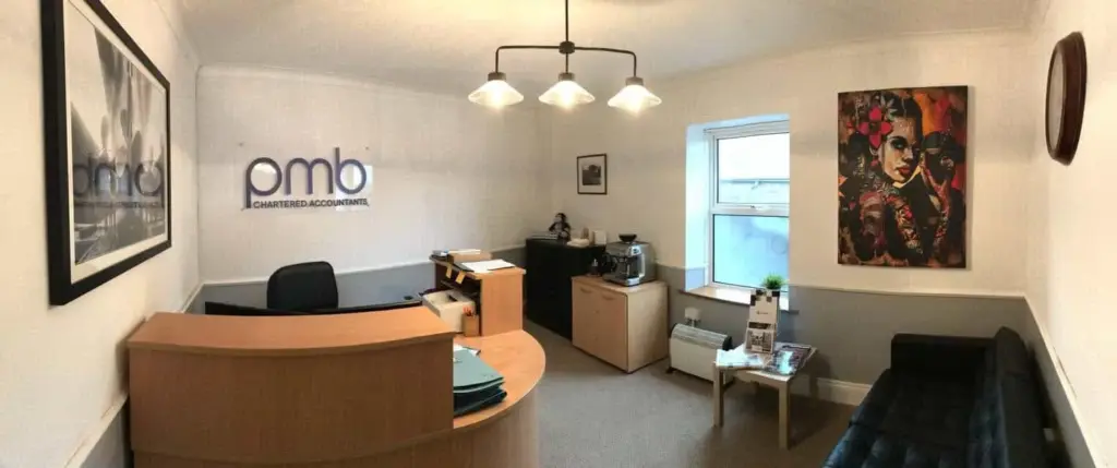 PMB accountants office interior with reception desk, window and lighting.